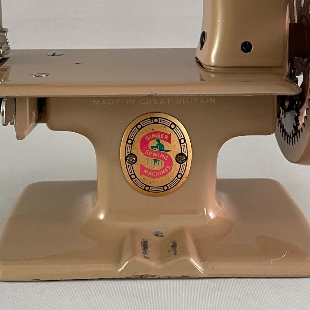 British Tan Singer 20 Red "S" Spoked Wheel Toy Sewing Machine With Clamp, Manual, Key and Adjusters Manual.