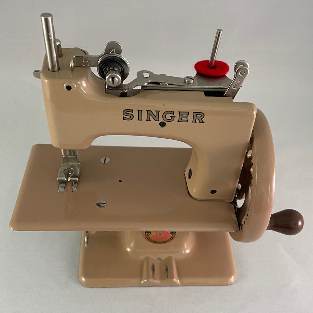 British red S Singer 20 toy sewing machine.