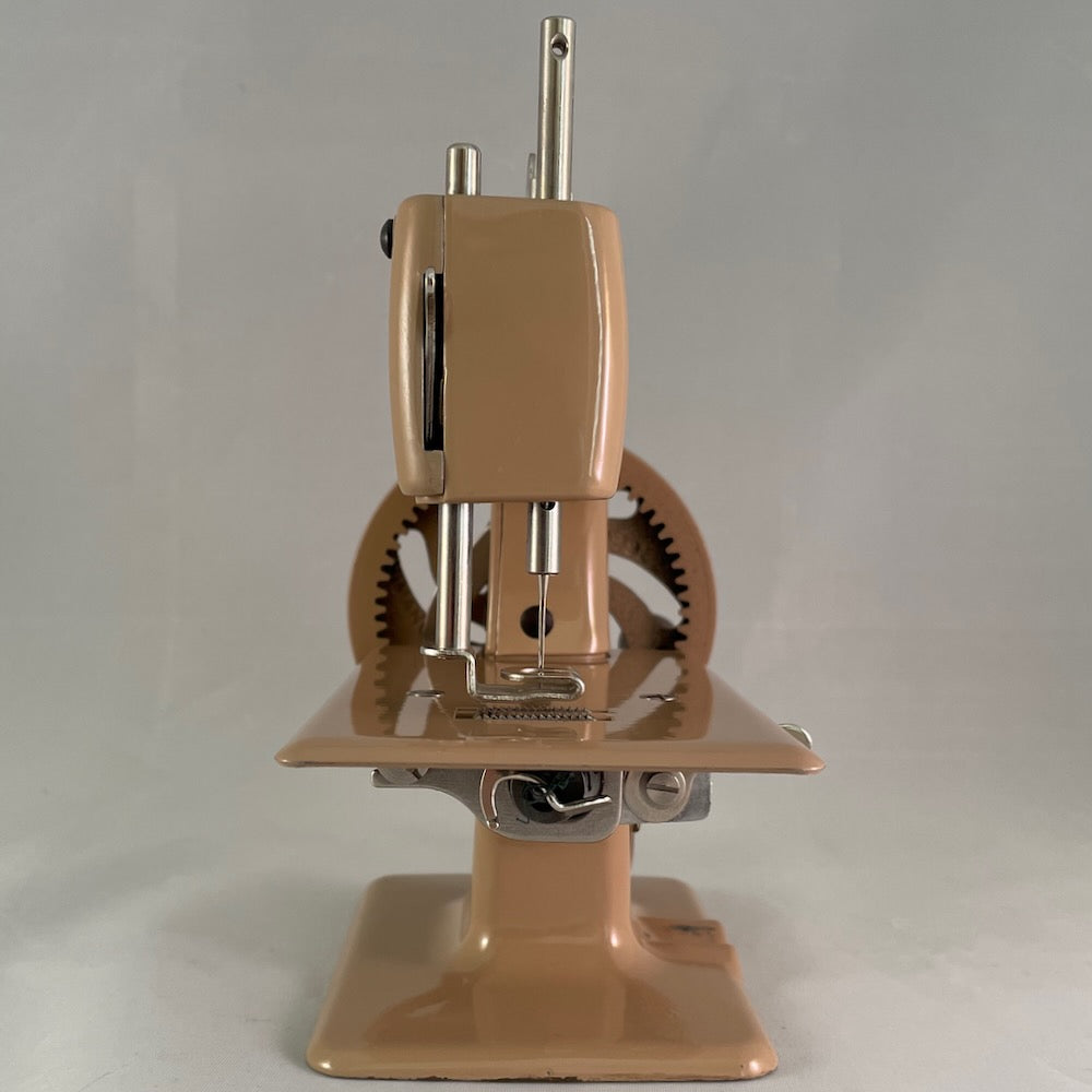 British Tan Singer 20 Red "S" Spoked Wheel Toy Sewing Machine With Clamp, Manual, Key and Adjusters Manual.